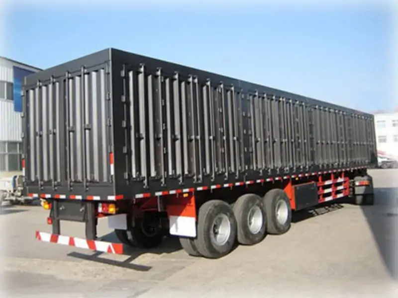 Containerized flatbed dump semi-trailer